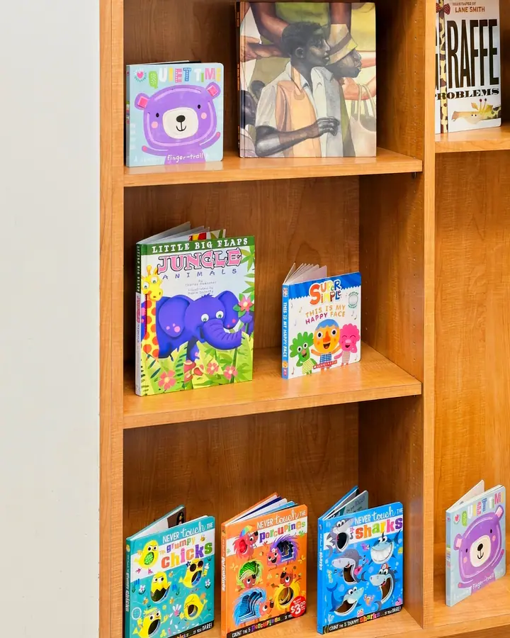 Children's books displayed on reading room shelves