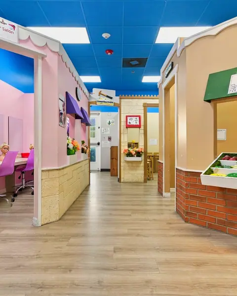 PlayTown pretend-play village with a grocery stand and storefronts