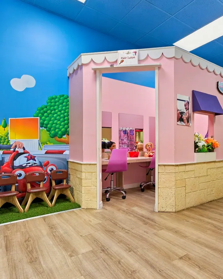 PlayTown post office corner and pink storefronts