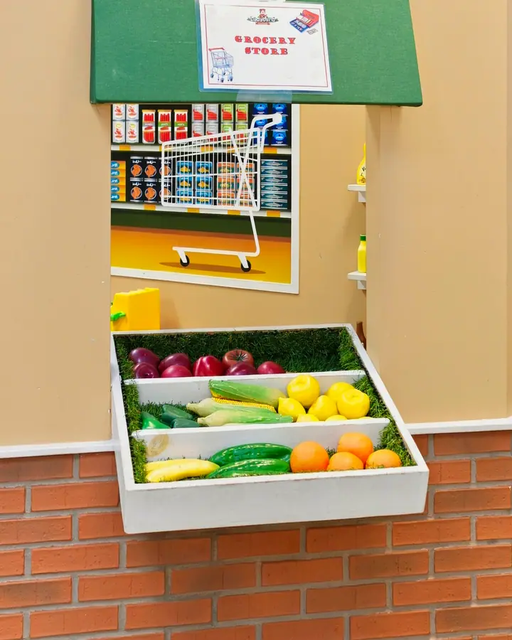 Play fruit and vegetables at the pretend grocery stand