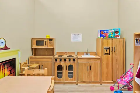 Wooden play kitchen with stove, sink and refrigerator