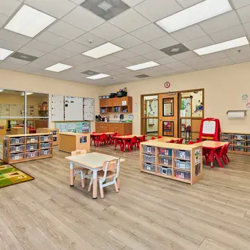 Open classroom with learning centers and labeled storage bins