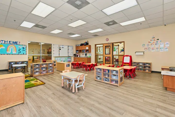 Open classroom with learning centers and labeled storage bins