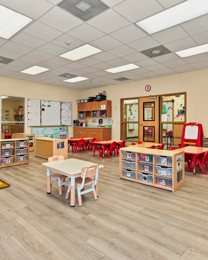 Open classroom with learning centers and labeled storage bins