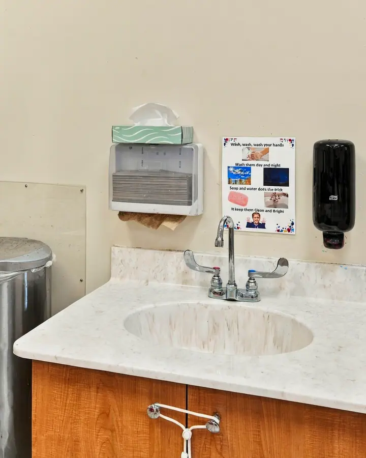 Child-height hand-washing sink in a classroom