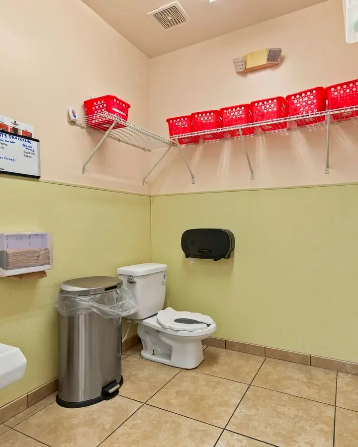 Child-size restroom with a low toilet and sink