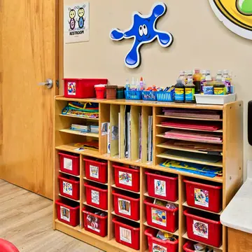 Art Studio cubbies stocked with paint and paper