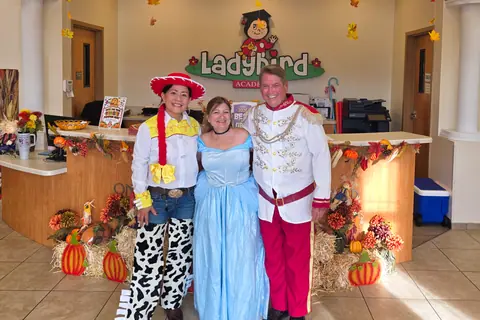 Ladybird staff dressed as storybook characters at the front desk